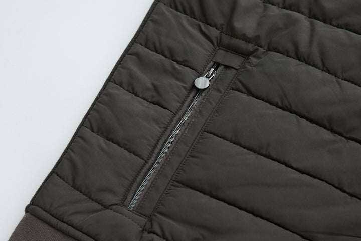 Dark peat quilted gilet with center front zipper and channel stitching