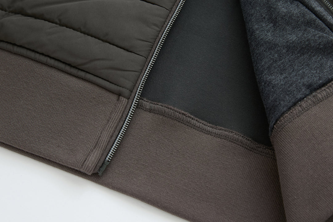 Dark peat gilet hem with ribbed knit facing and zipper edge