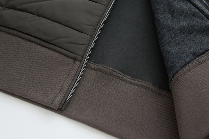 Dark peat gilet hem with ribbed knit facing and zipper edge
