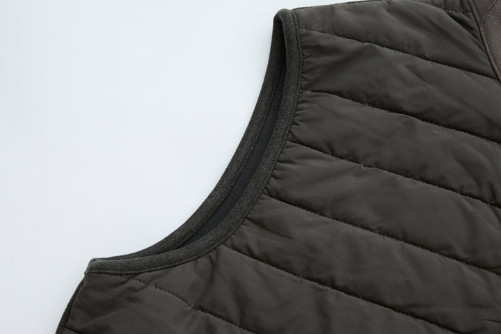 Dark peat gilet armhole and neckline with smooth quilted trim