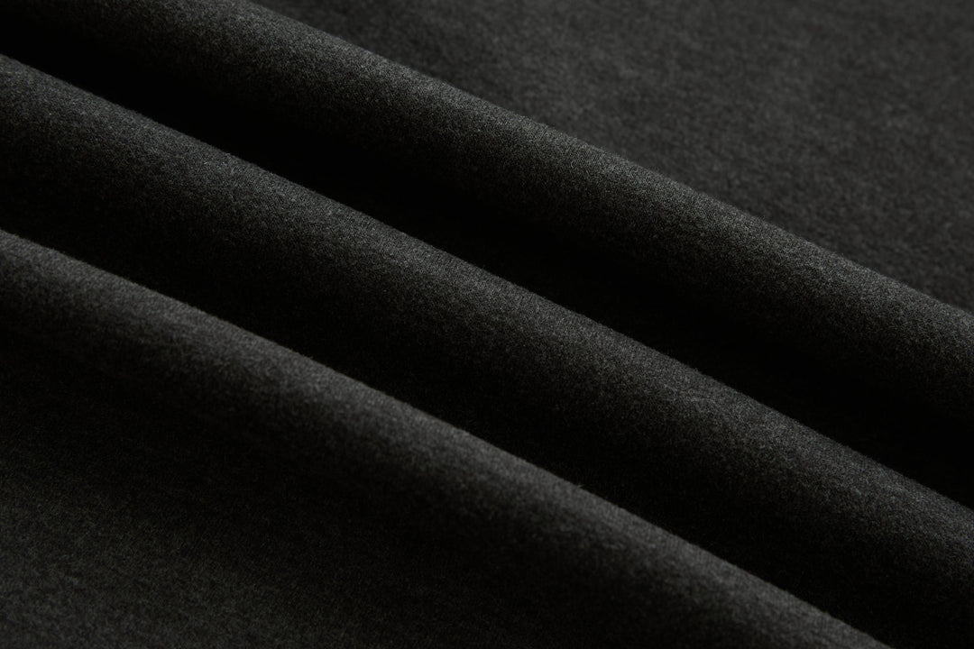 Dark peat quilted gilet fabric close-up