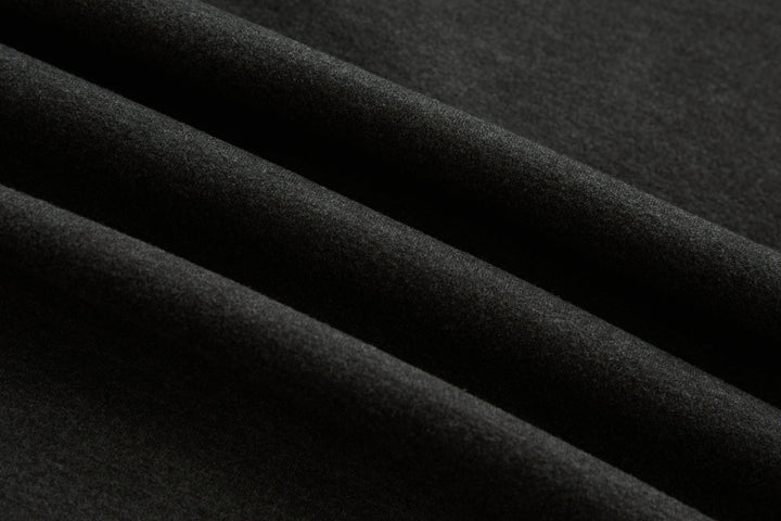 Dark peat quilted gilet fabric close-up