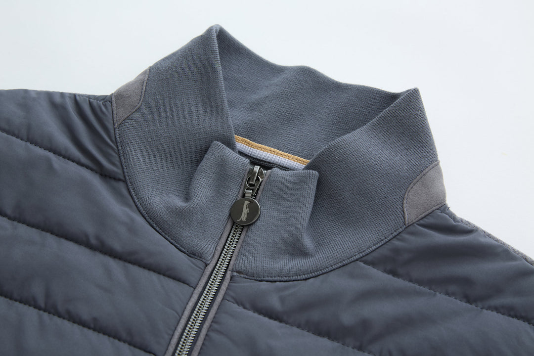 Dark gray-blue gilet collar and zip opening with metal zipper pull