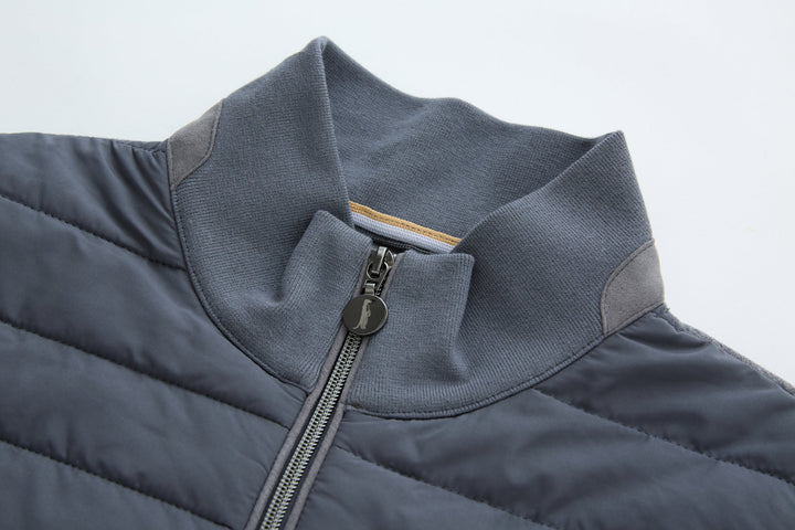 Dark gray-blue gilet collar and zip opening with metal zipper pull