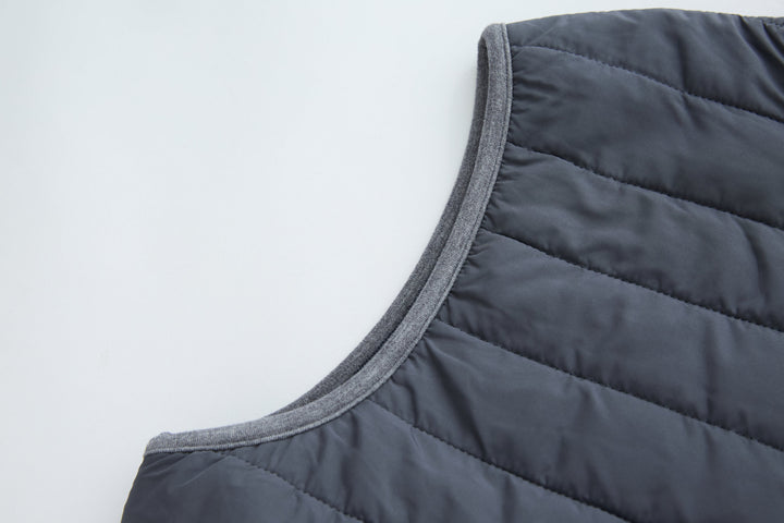 Dark gray-blue sleeveless gilet with bound armhole and quilted yoke