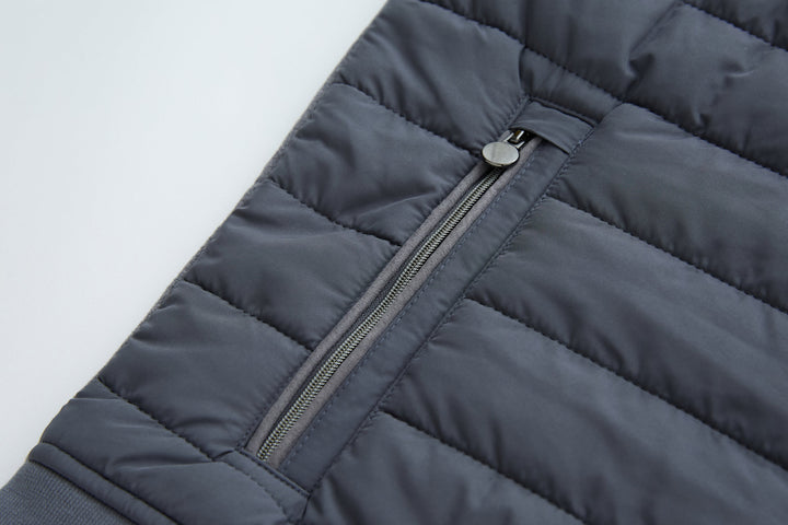Dark gray-blue quilted gilet with zip guard and snap button at top