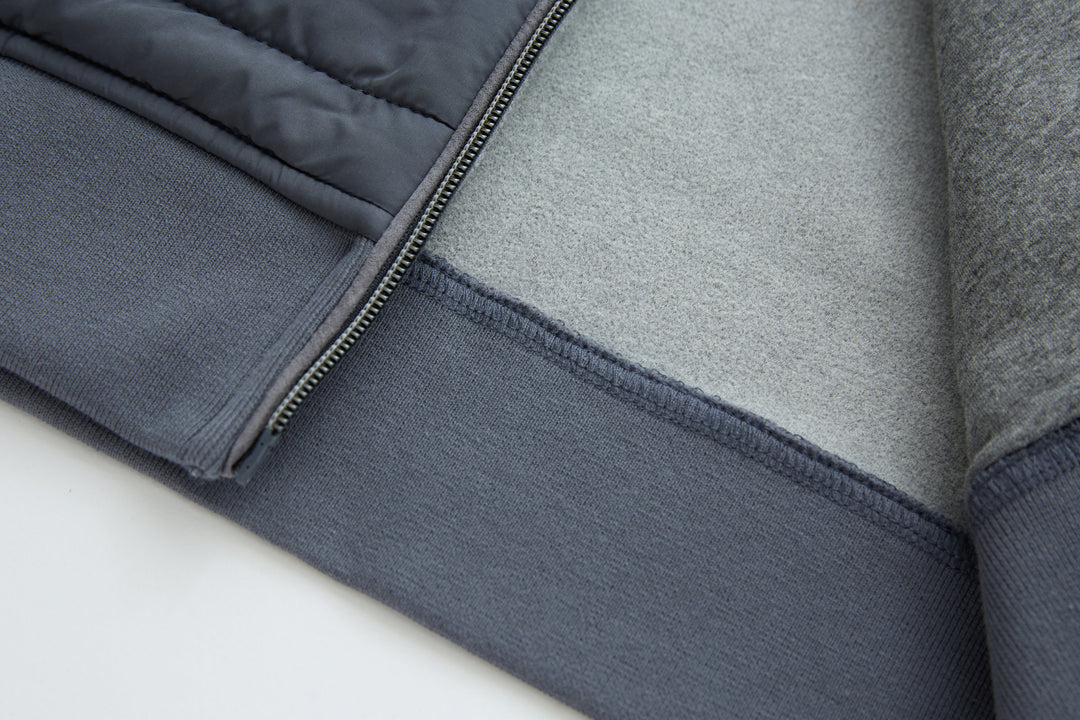 Dark gray-blue gilet hem with binding and quilted lower panel