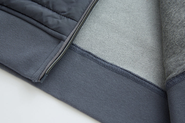 Dark gray-blue gilet hem with binding and quilted lower panel