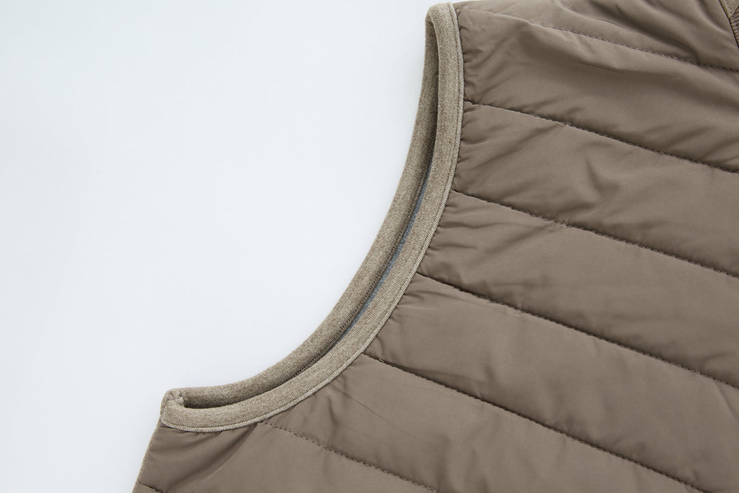 Taupe sleeveless gilet with ribbed armhole binding and quilted chest panels