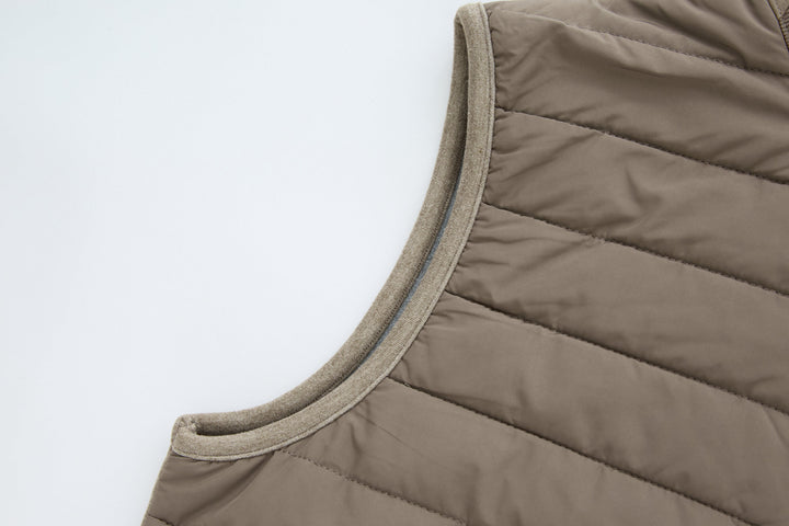 Taupe sleeveless gilet with ribbed armhole binding and quilted chest panels