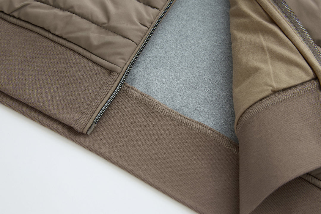 Taupe quilted gilet with contrast zipper tape and smooth knit trim