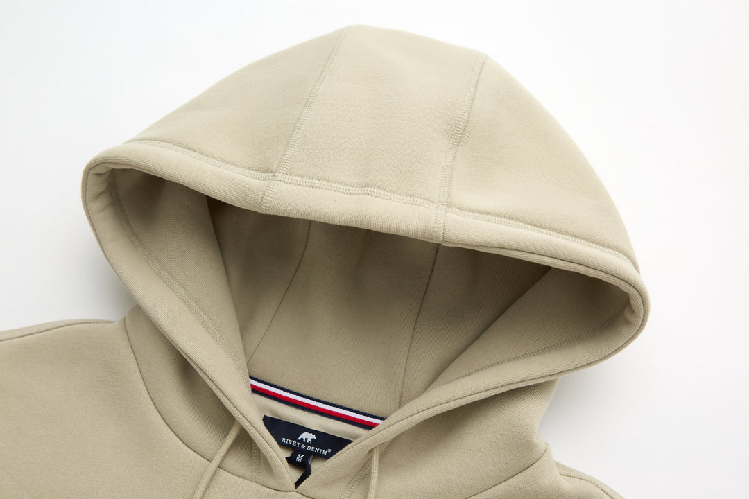 Rivet & Denim hoodie with attached hood, interior lining and drawstring tips visible