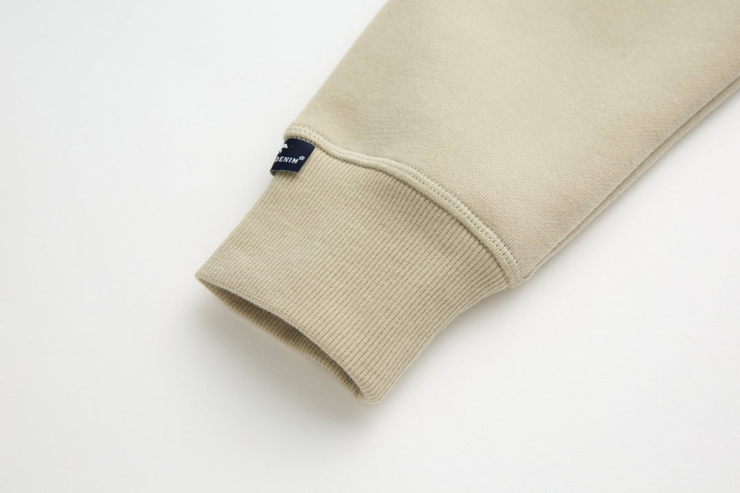 Rivet & Denim hoodie sleeve cuff, ribbed hem in light feather beige
