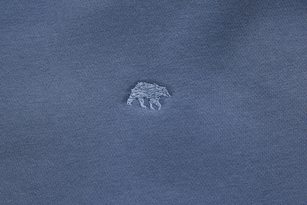 Blue denim hoodie chest logo embroidery detail