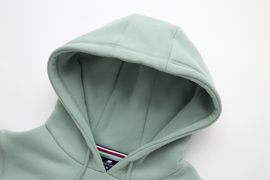 Jade denim hoodie with attached hood and drawstring, showing inner lining and seams.
