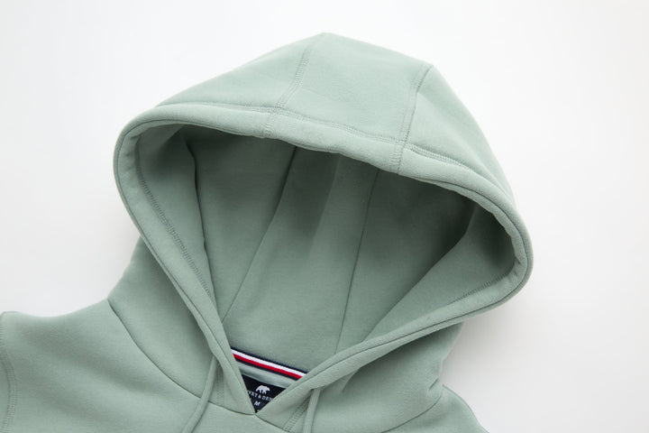 Jade denim hoodie with attached hood and drawstring, showing inner lining and seams.