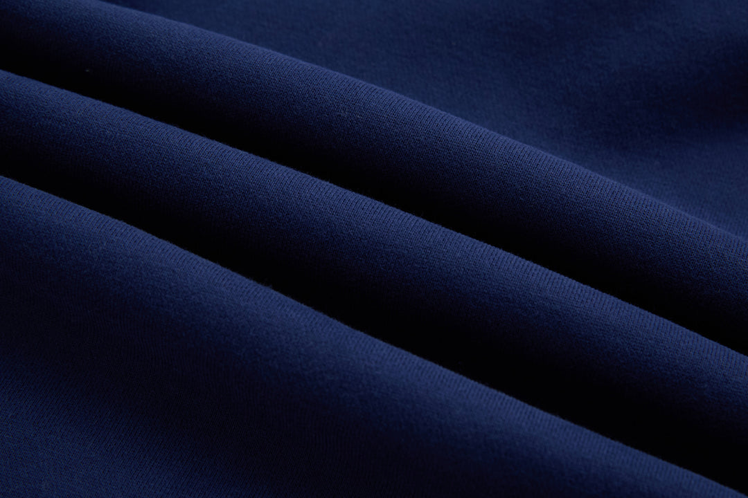 Navy denim hoodie fabric close-up with fine textured weave