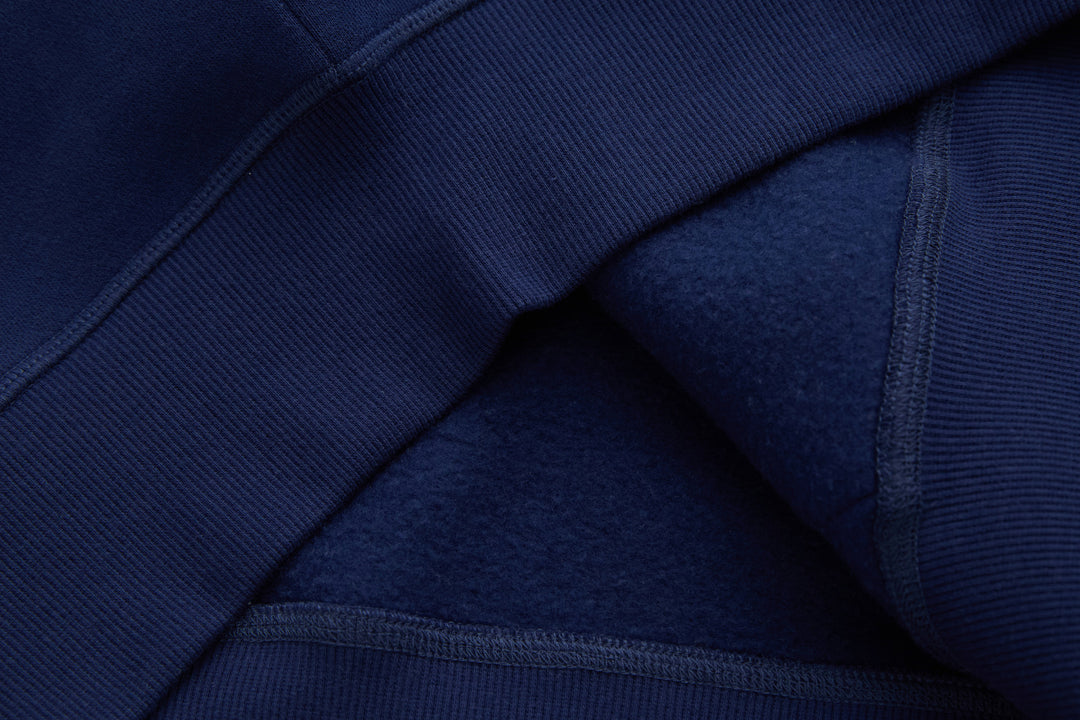 Navy denim hoodie seam detail with ribbed knit cuff