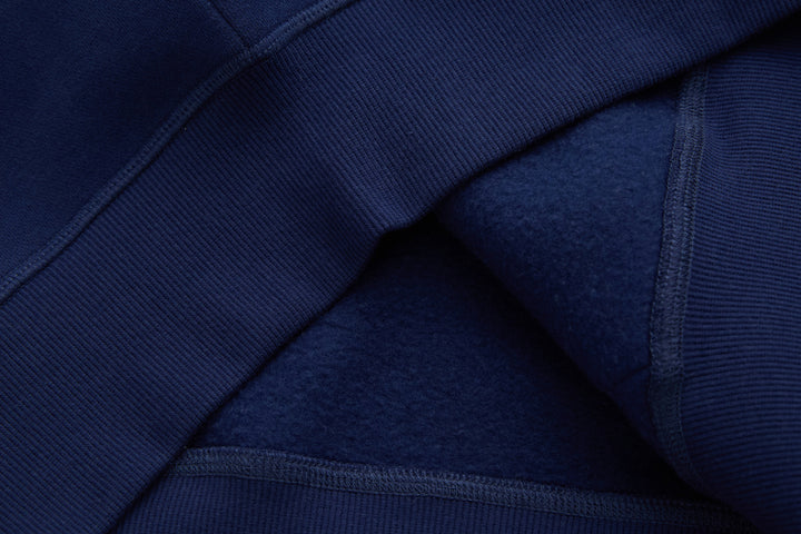 Navy denim hoodie seam detail with ribbed knit cuff