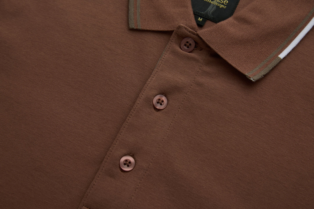 Brown polo shirt placket with three buttons and contrast collar trim