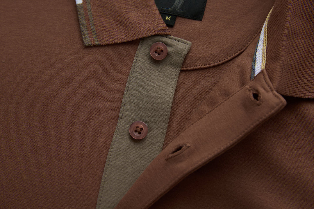 Brown polo shirt chest detail with welt pocket and contrast inner placket