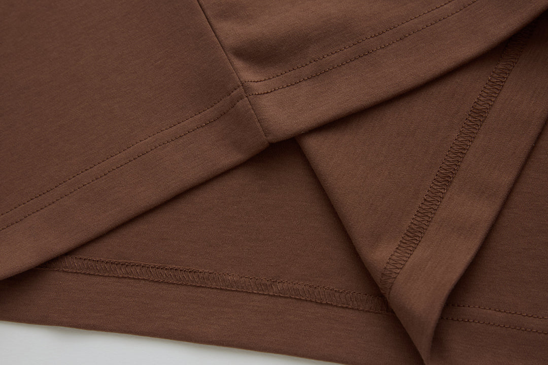 Brown polo shirt with seam stitching and reinforced hem finish