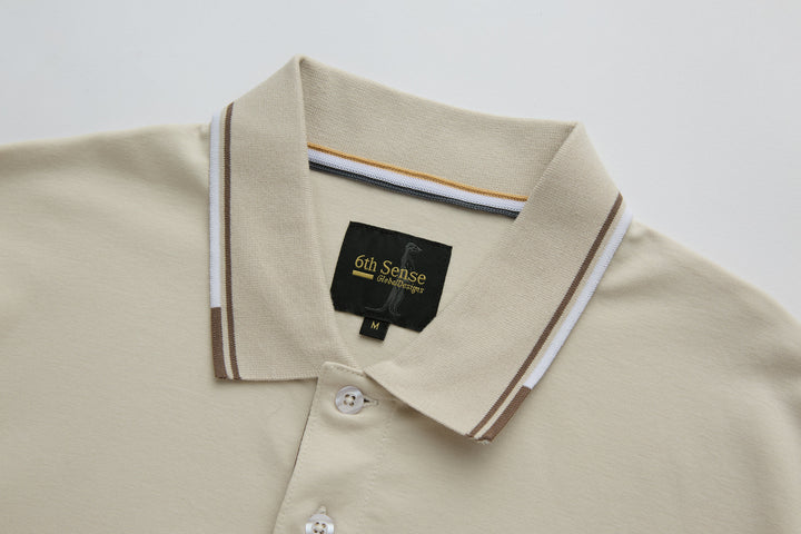 Cream polo shirt collar with striped trim and button placket