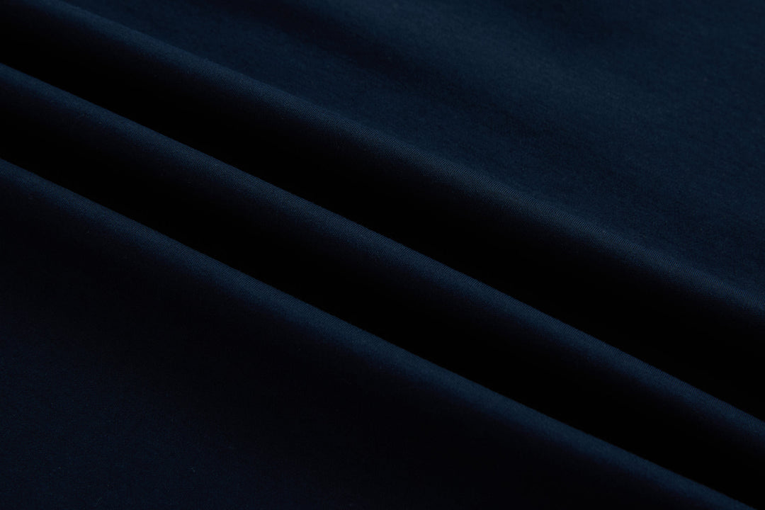 Dark navy polo shirt fabric close-up