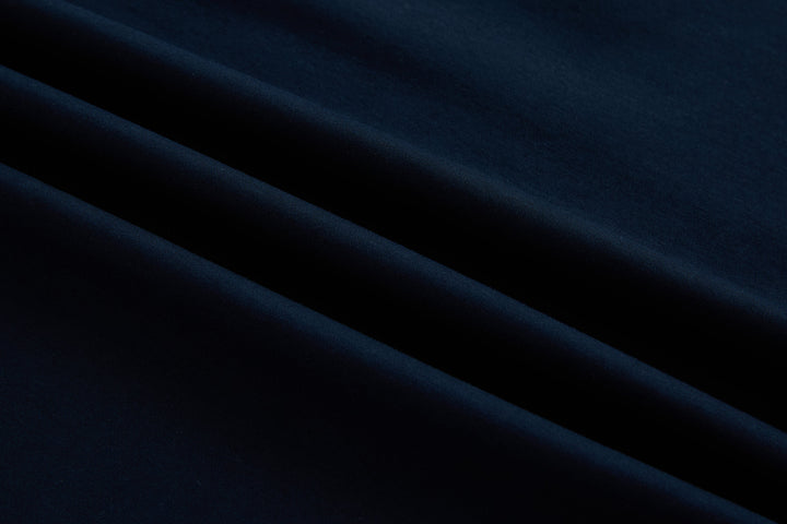 Dark navy polo shirt fabric close-up
