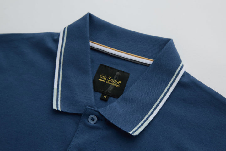 Blue polo shirt collar with button placket and contrast striped edging