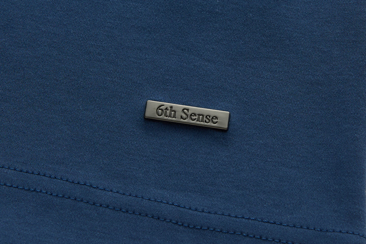 Blue polo shirt with 6th Sense stitched neck label