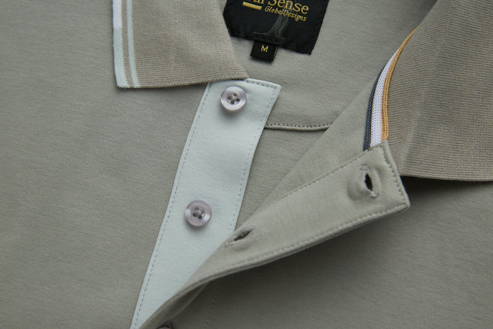 Light gray polo shirt collar and placket with button closure and neckline label