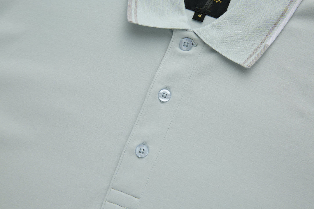 Oyster polo shirt front with three white buttons and stitched placket
