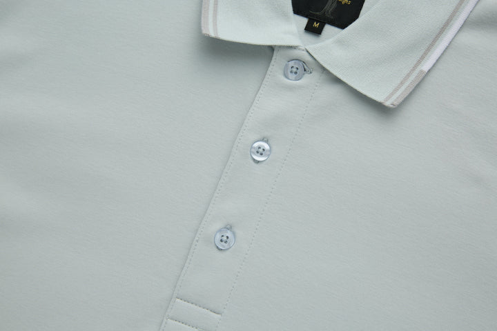 Oyster polo shirt front with three white buttons and stitched placket