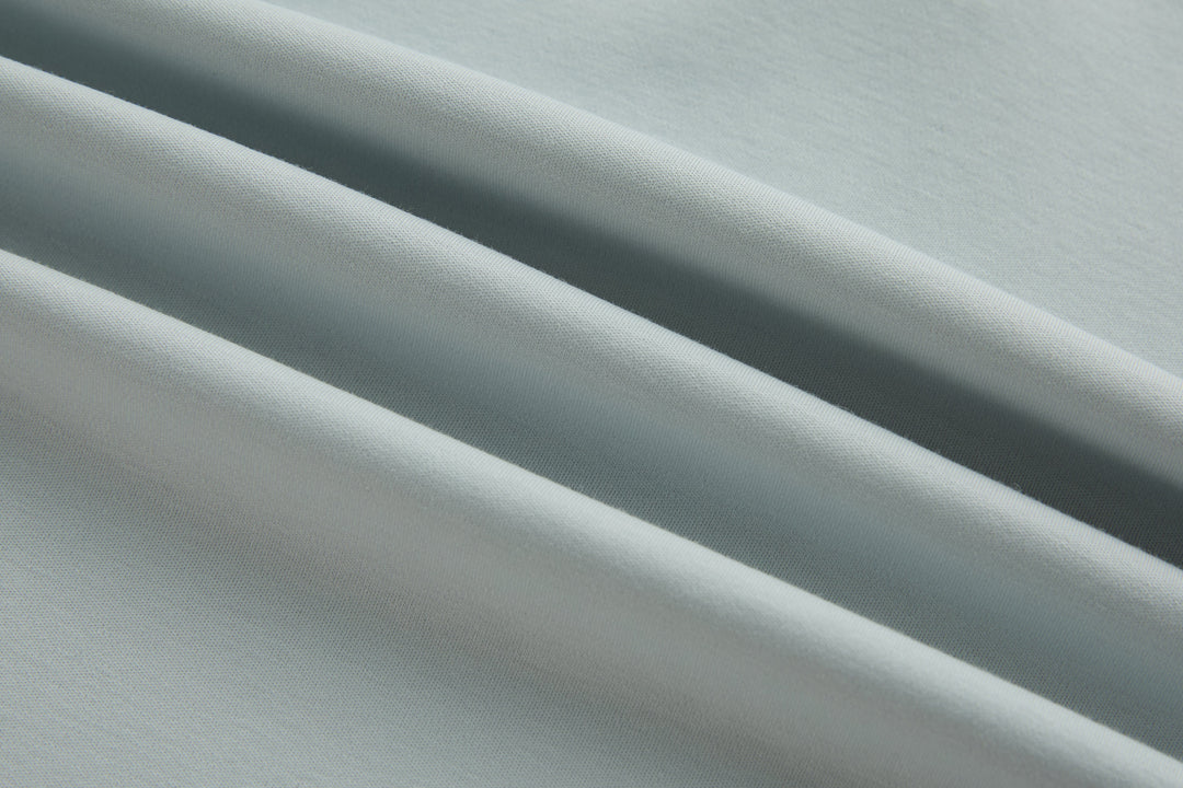 Oyster polo shirt fabric close-up with smooth woven texture