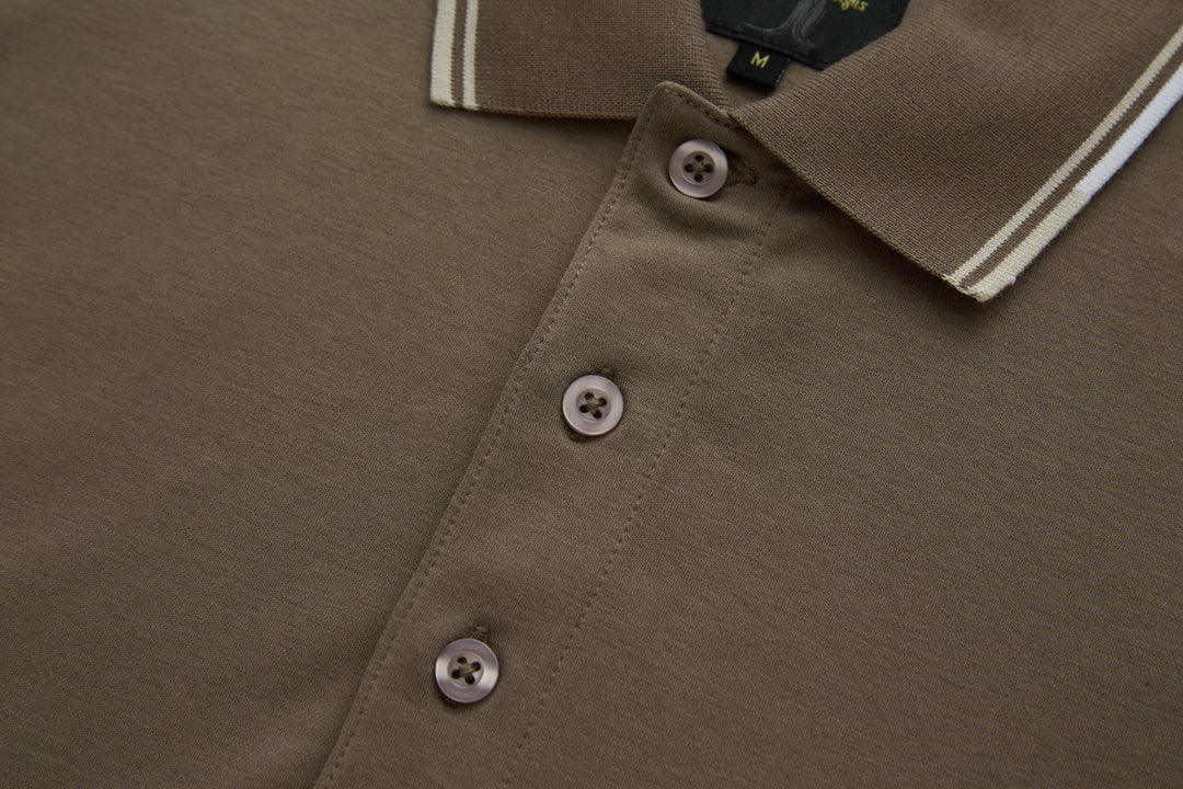 Walnut polo shirt button placket with three buttons and striped collar