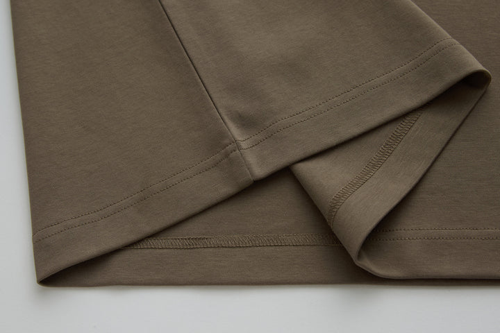 Walnut polo shirt side seam and straight hem with clean stitching