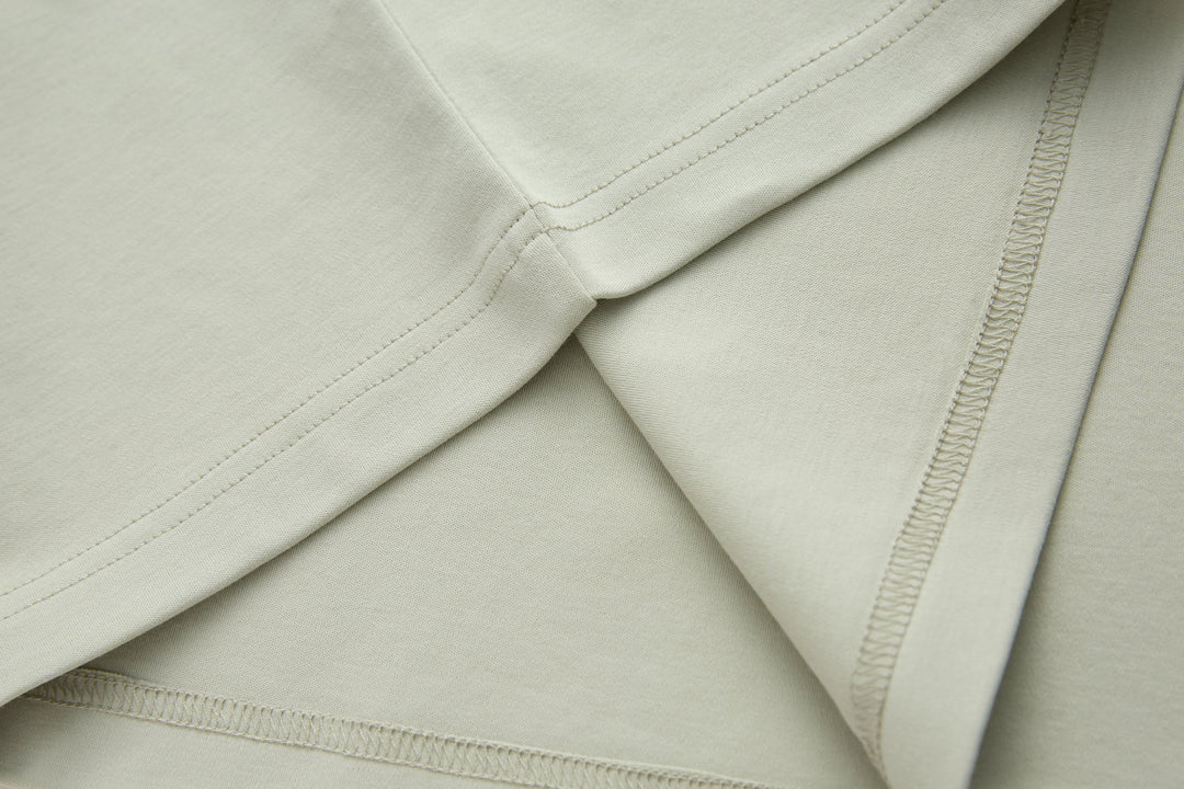 Celadon t-shirt sleeve hem with double-stitched seam detail