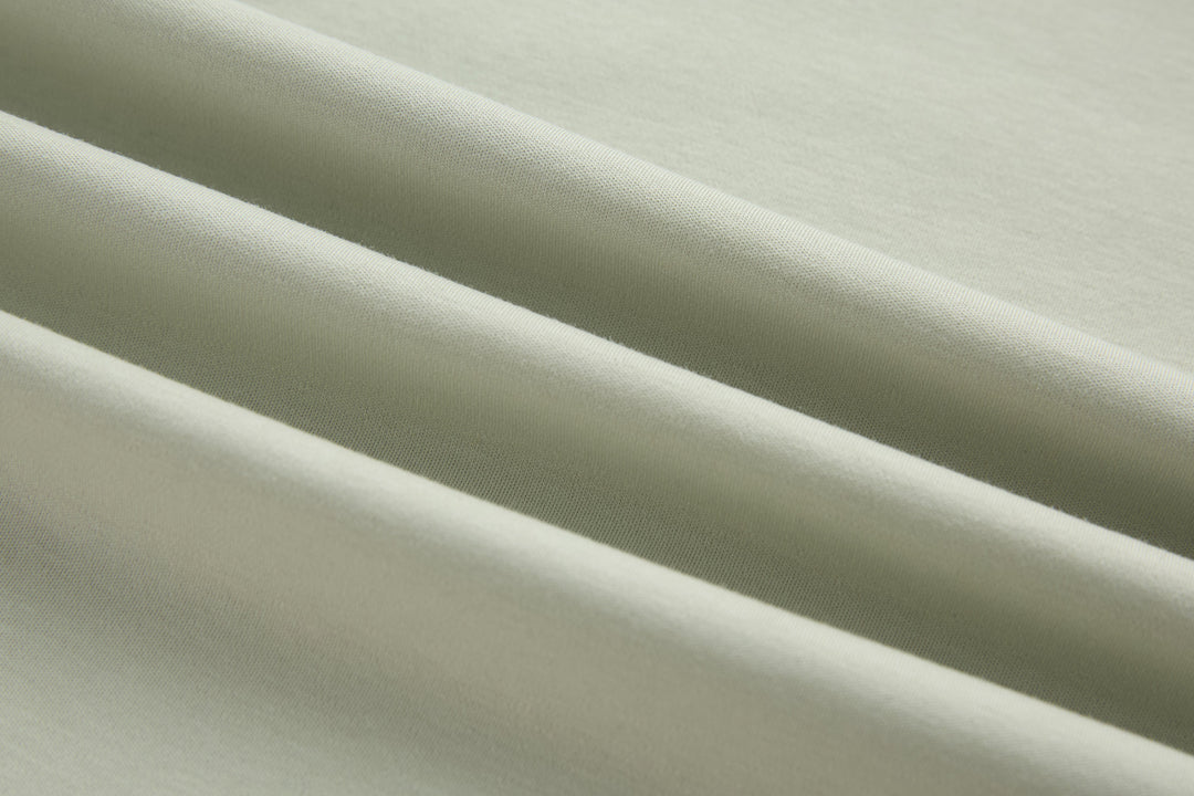 Celadon t-shirt fabric close-up, smooth knit texture