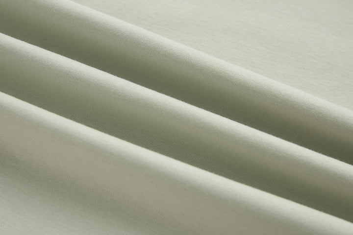 Celadon t-shirt fabric close-up, smooth knit texture