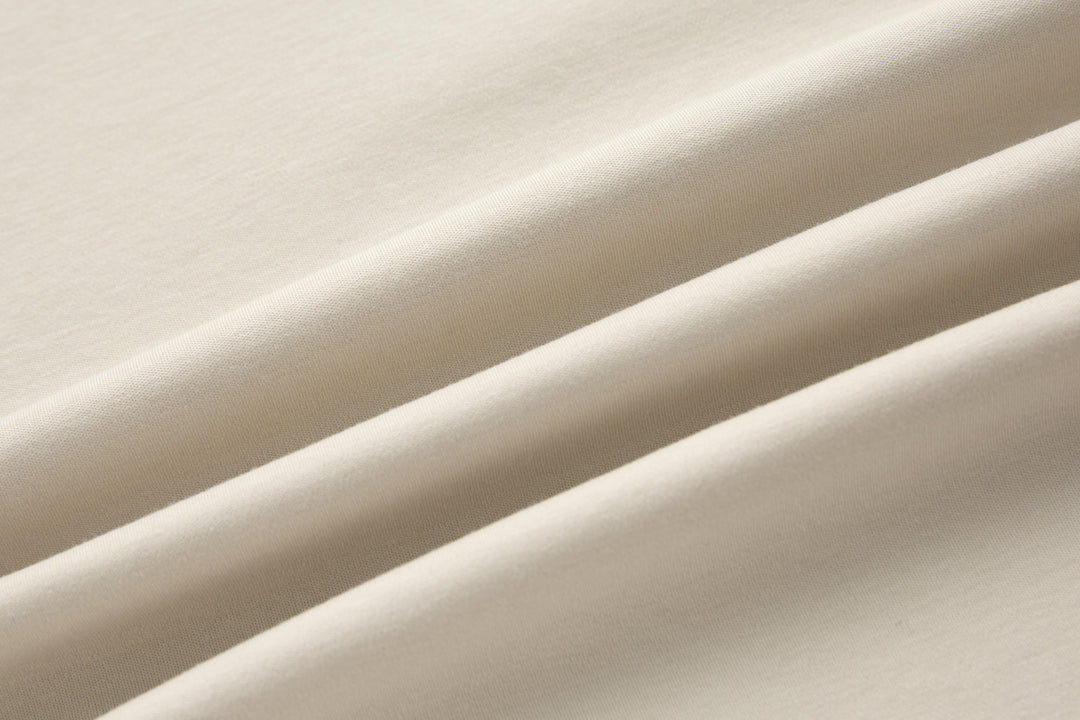 Crystal 6th Sense T-shirt fabric close-up, smooth light cream knit
