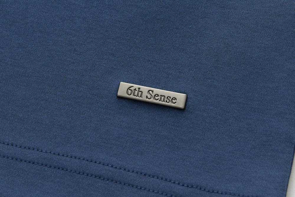 6th Sense T-shirt logo tag at chest with dark blue fabric