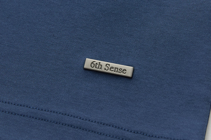 6th Sense T-shirt logo tag at chest with dark blue fabric