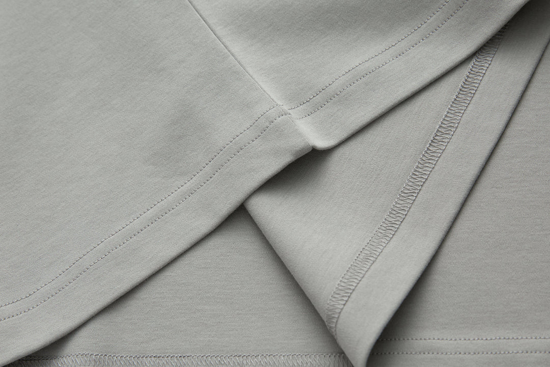 Light gray T-shirt with double-stitched seams and clean edge stitching
