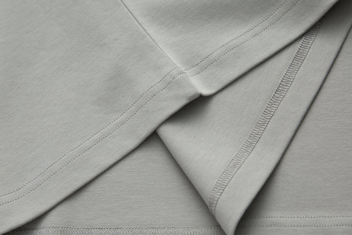Light gray T-shirt with double-stitched seams and clean edge stitching