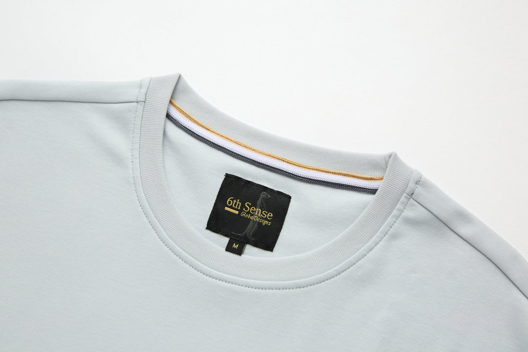 Oyster light blue T-shirt with crew neck and 6th Sense brand label at chest