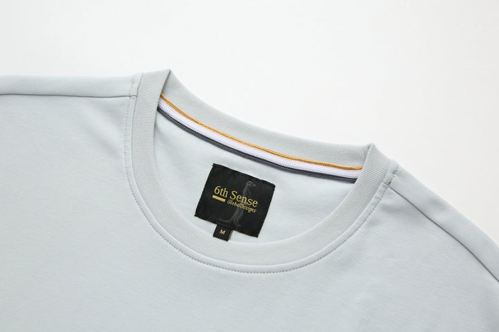 Oyster light blue T-shirt with crew neck and 6th Sense brand label at chest