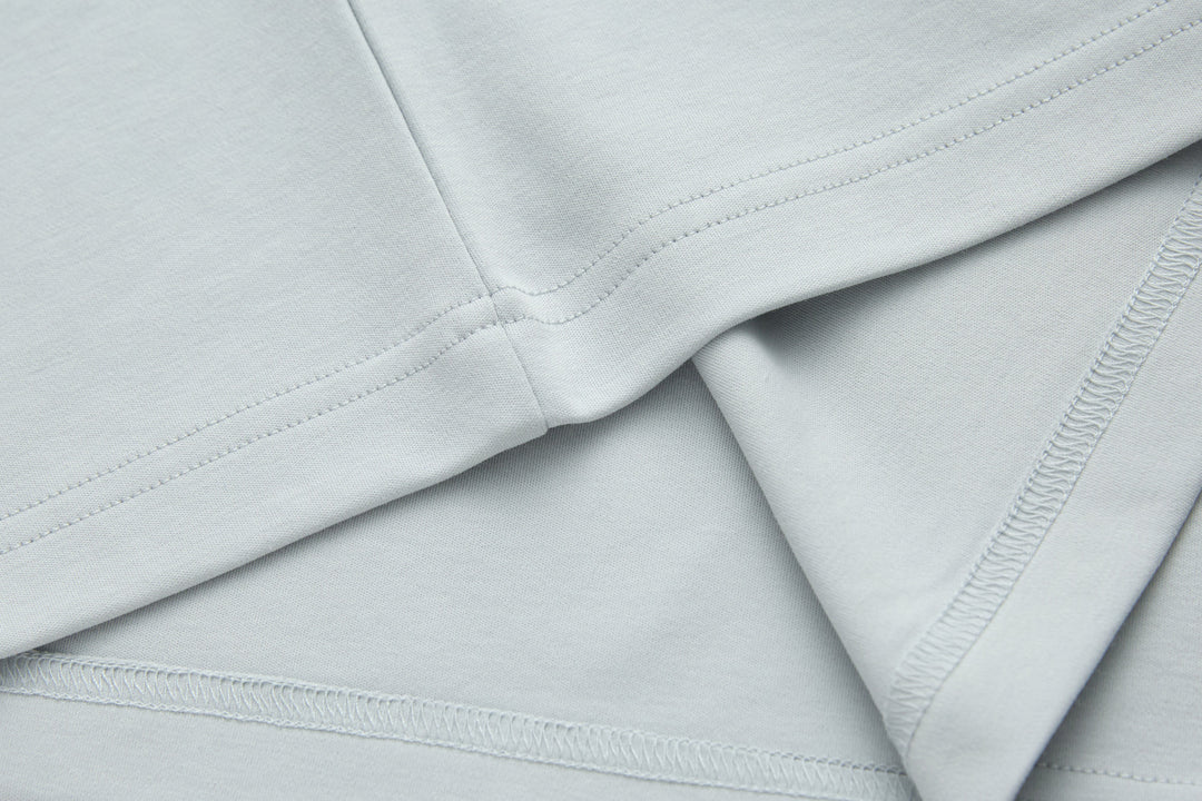 Oyster light blue T-shirt with stitched collar seam and curved neckline