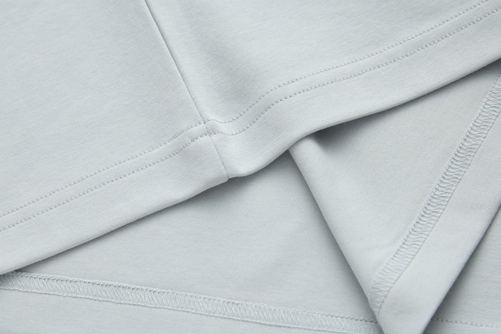 Oyster light blue T-shirt with stitched collar seam and curved neckline