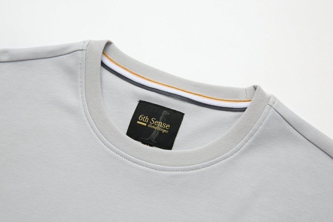 Light gray crew-neck T-shirt with 6th Sense label at collar